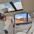 Интерьер BMW X5 с люком и сенсорными экранами для пассажиров за передними подголовниками